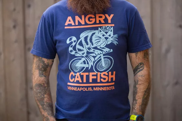 angry-catfish-merch15th-anniversary-tee-navy Angry Catfish Merch15th Anniversary Tee - Navy